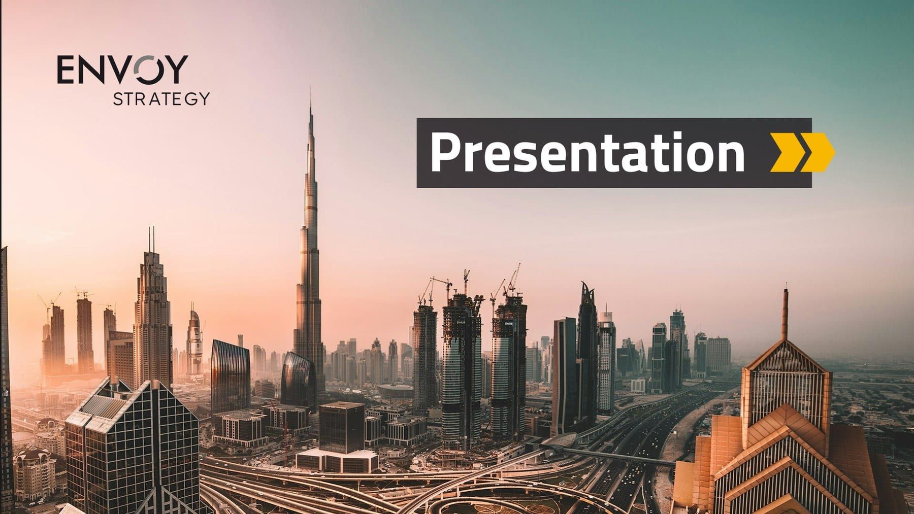 The cover slide: a sunset photograph of the Dubai skyline, the Envoy Strategy logo top left and the word “Presentation” on a dark band with two yellow chevrons.